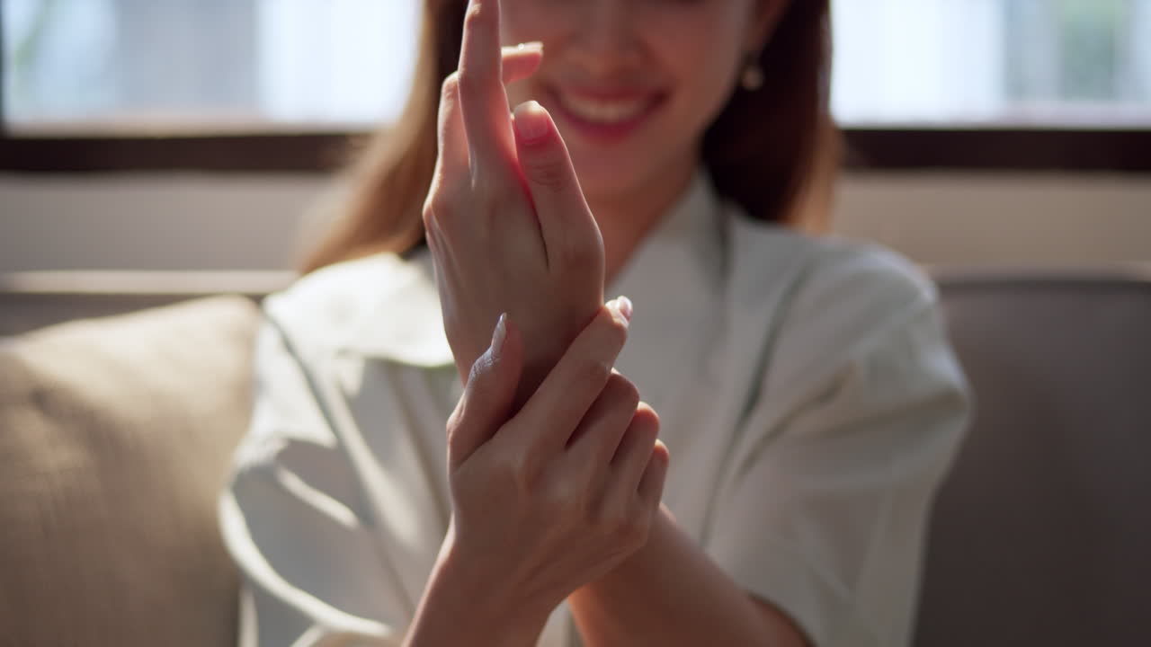 A close-up of a woman's hand making a graceful gesture symbolizing communication and emotion.