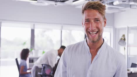 Professional-businessman-smiling-while-standing-in-modern-office-in-slow-motion