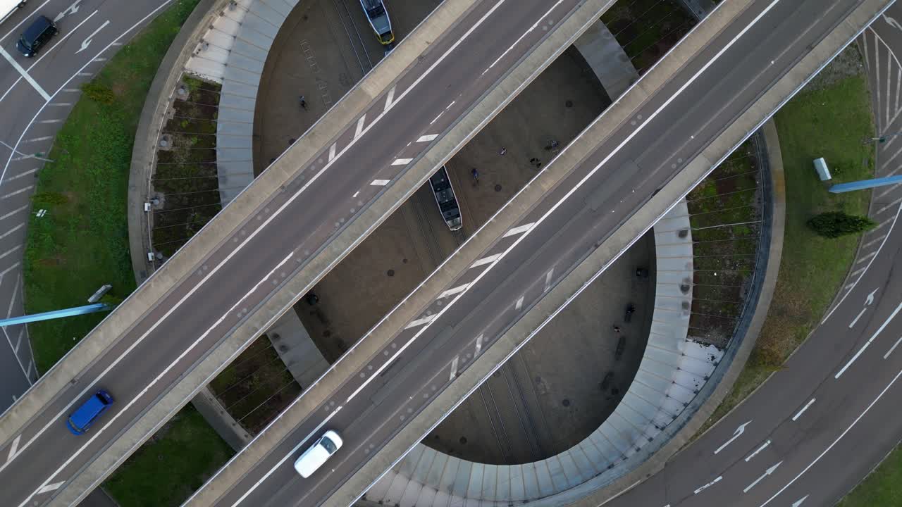 Aerial View of a Complex Highway Intersection with Trams and Cars