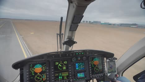 first-person view from inside the cockpit of the bell 249 helicopter as it takes off from the runway at the vaclav havel airport in prague