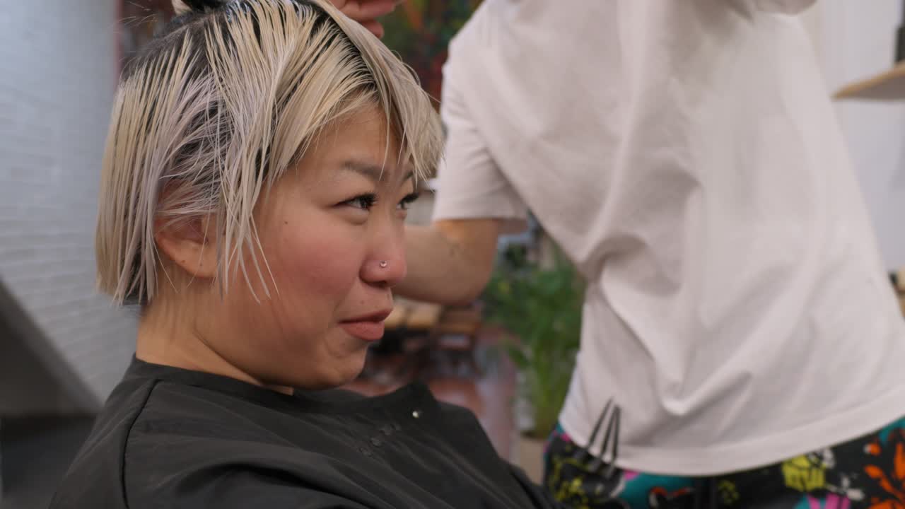Woman getting hair done