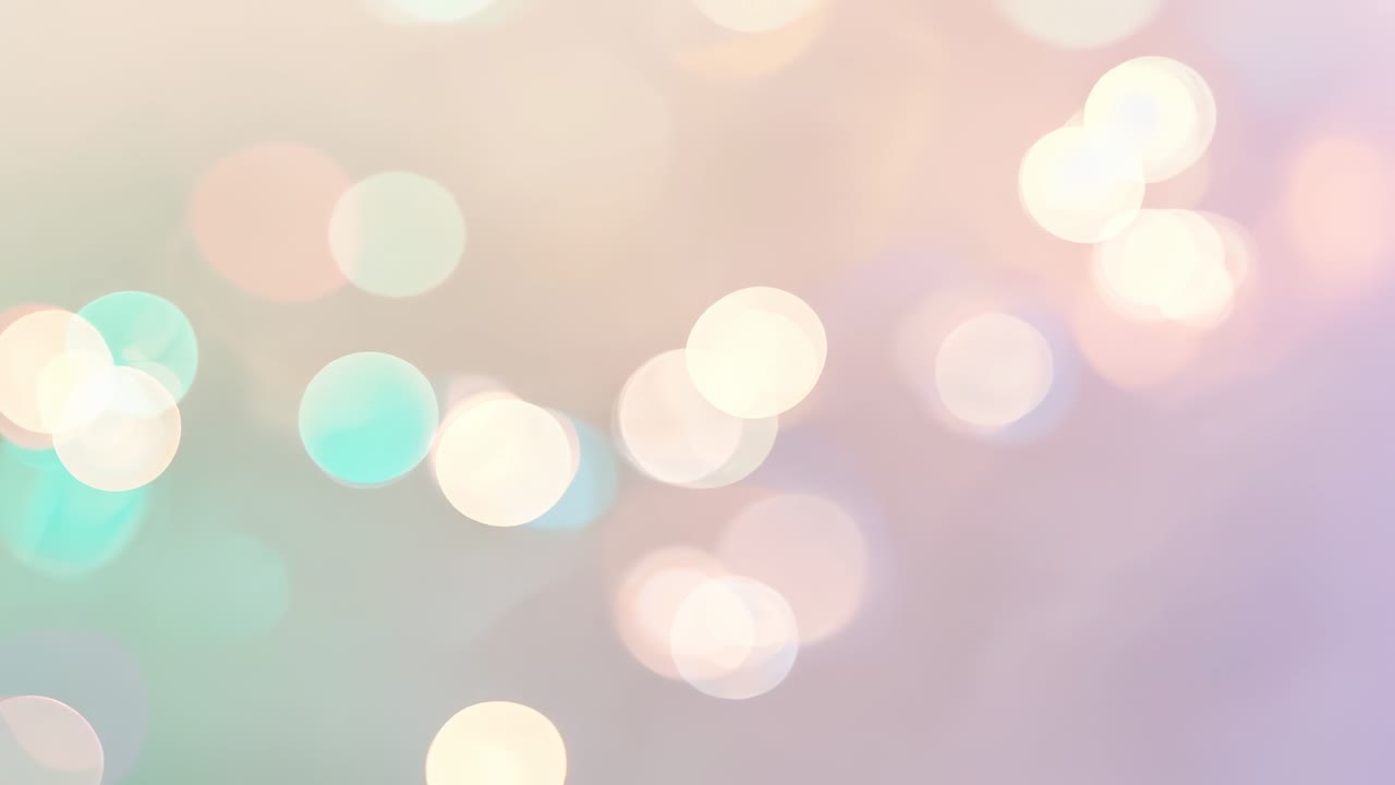 Looping pastel bokeh light spots softly shimmering with brightness shifts in abstract field