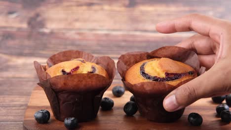 blueberry muffins on wooden board