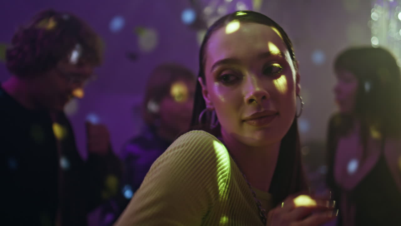 Energetic girl enjoy clubbing in dark nightclub closeup. Sensual woman dancing