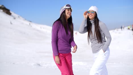 two attractive women friends at a ski resort