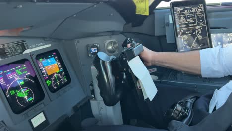 Stunning-view-inside-a-jet-cockpit-while-copilot-is-flying-the-plane-in-a-real-and-bumby-approcah