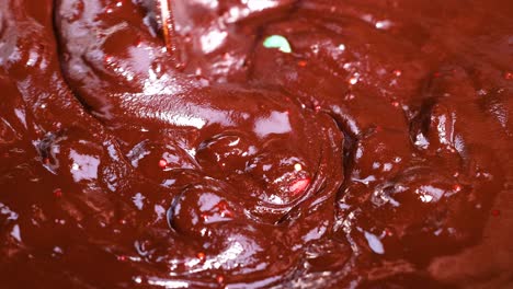 mixing chocolate and candies in a bowl