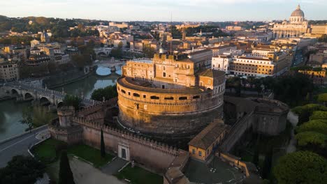 drone orbits above castel sant'angelo, reveals saint peter's basilica in background