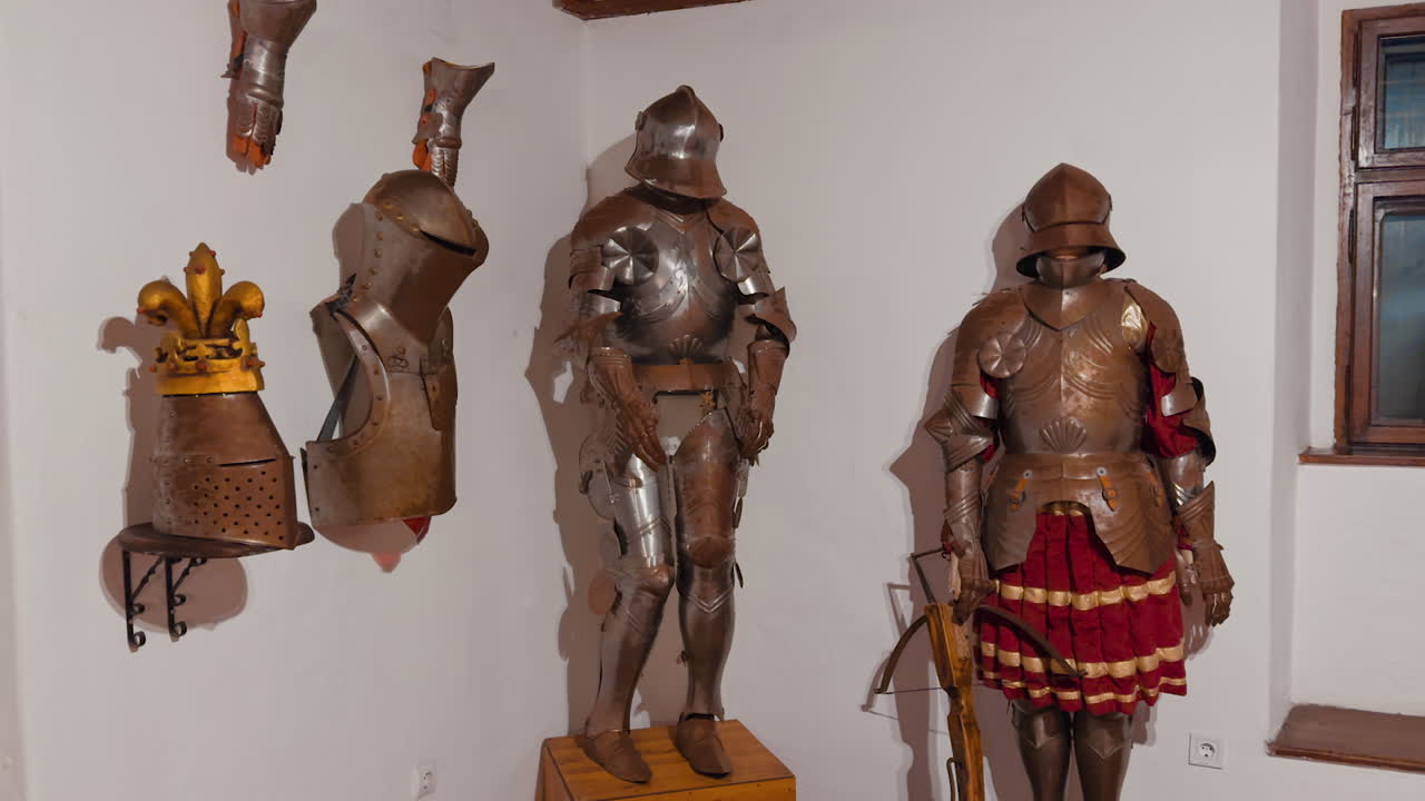 Knight's armor exhibited in the room. Showpieces in old castle of Bran in Romania.