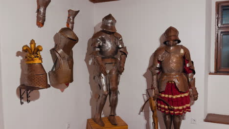 knight's armor exhibited in the room. showpieces in old castle of bran in romania.