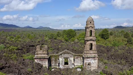 smooth dolly shot moves backwards, revealing the ruins of the church of san juan parangaricutiro
