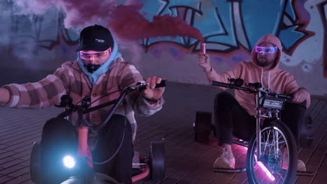 embarking on a vibrant urban biking adventure beneath colorful graffiti artwork in the city