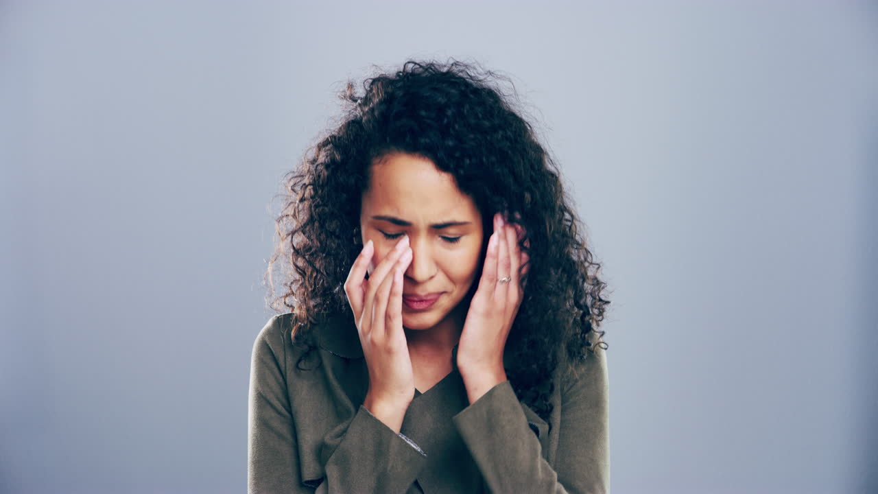 Woman expressing negative emotions in a studio setting