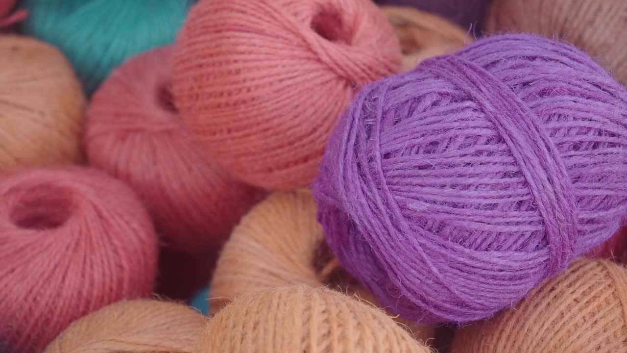 Close-Up View of Assorted Colorful Yarn and Twine Balls