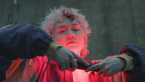 girl dancing with red light lamp outdoors