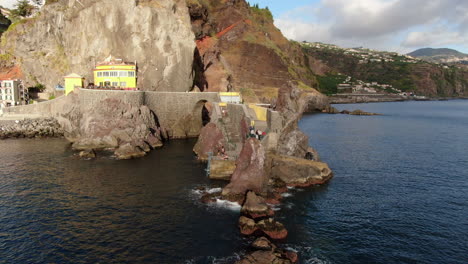 fantastic aerial shot in orbit to the bridge and the city ponta do sol on the island of madeira on a sunny day