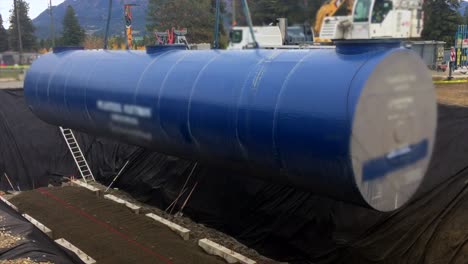 huge fuel storage tank lifted into pit by mighty heavy duty crane