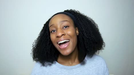 young student singing happy birthday directly to camera during video call