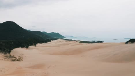 massive sand dunes landscape of garopaba beach in the back aerial view