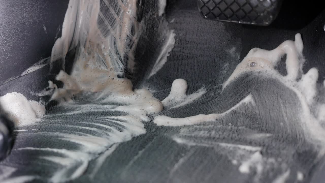 Anonymous person doing car cleaning