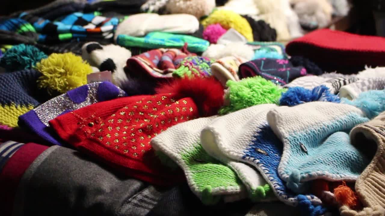 caps at a stall in the Christmas markets