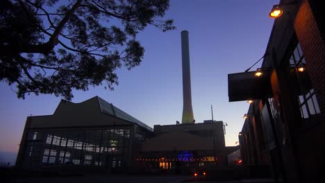 wide shot of a large warehouse or factory at dusk or sunset 3