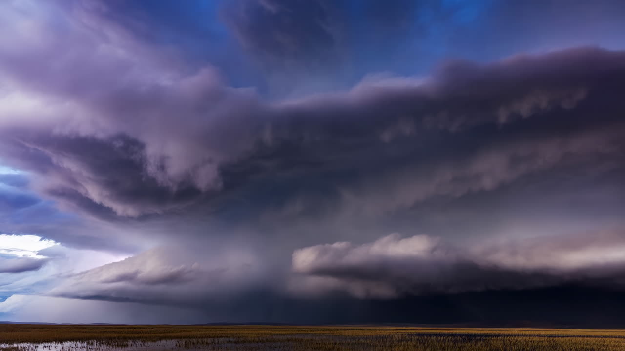 Time-Lapse of Intense Storm Clouds with Lightning Over a Field