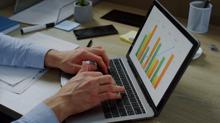 Closeup businessman hands typing on laptop computer