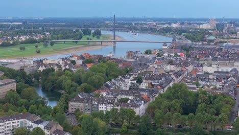 aerial view over downwown dusseldorf towards oberkasseler bridge and rhine river