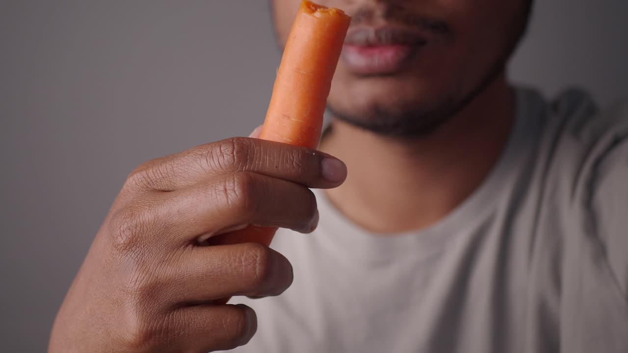 Person eating a carrot