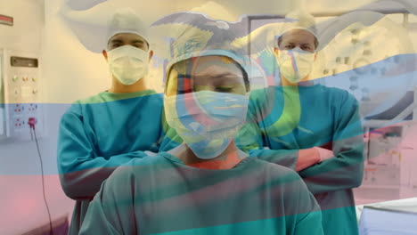 animation of flag of ecuador waving over surgeons in operating theatre