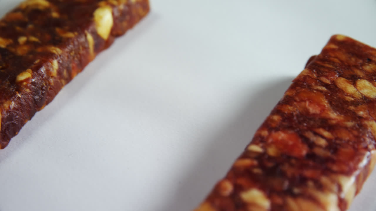 Granola bars on white background 4k