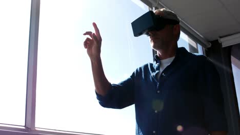 Male-executive-using-virtual-reality-headset