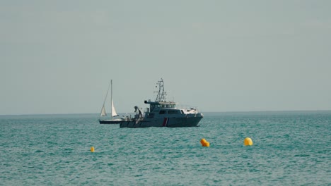 Slow-motion-shot-of-a-French-Navy-Warship-coming-into-dock-at-the-Palavas-les-flot-airshow