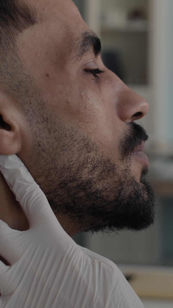 Close-up of a man getting a medical examination