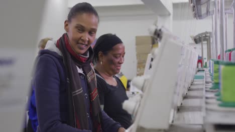 group of mixed race women working in factory