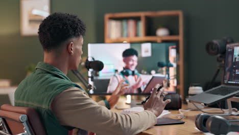 man working in a home office recording a video