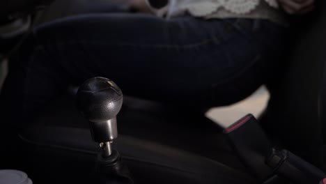 female driver getting into car interior  medium shot