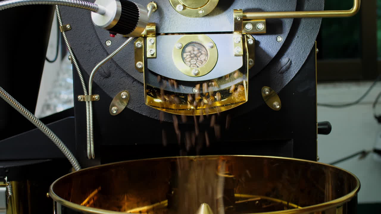 The Freshly Roasted Coffee Beans From A Coffee Roaster Being Poured Into The Cooling Cylinder
