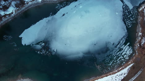 ascending flight of the ice cover on a frozen mountain lake