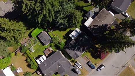 A-breathtaking-aerial-view-of-a-luxurious-suburban-neighbourhood-in-Surrey,-BC-featuring-sprawling-estates-with-lush-green-lawns-and-tall-trees