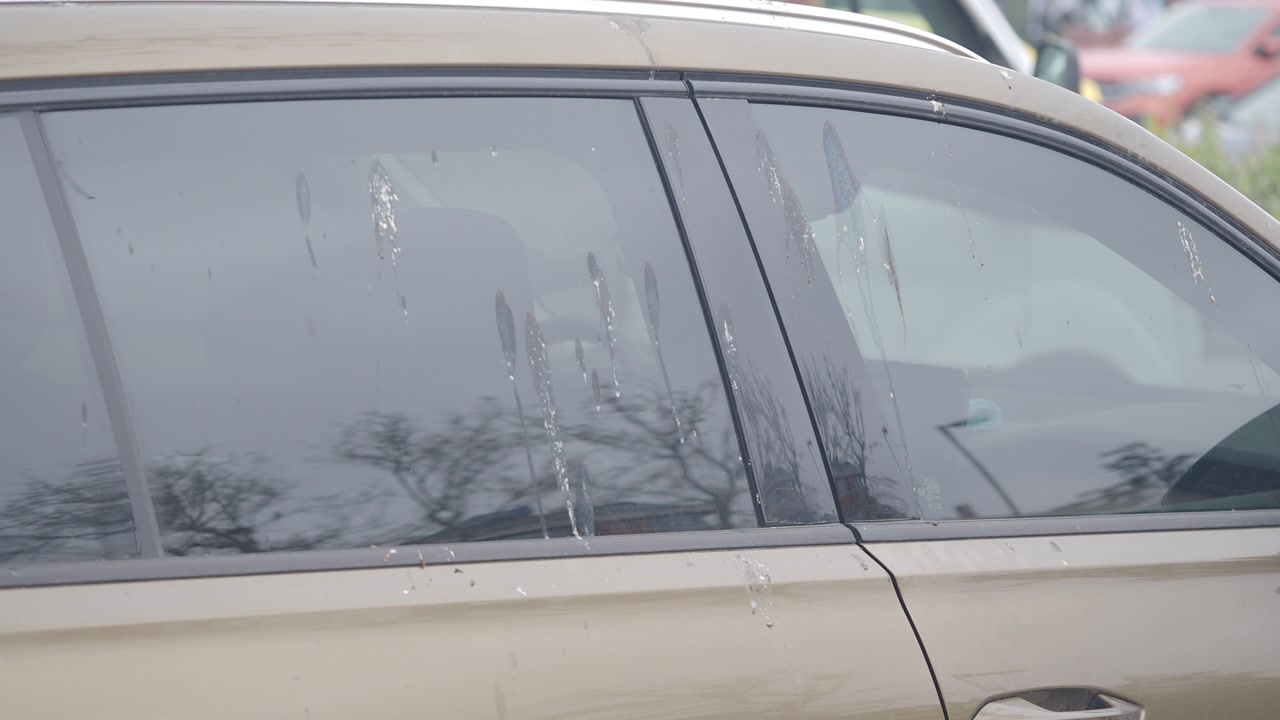 Rainwater Dripping Down Dirty Car Windows