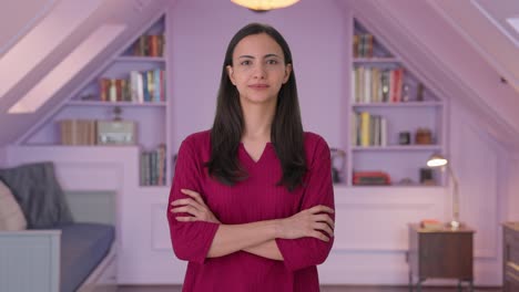 Happy-Indian-woman-standing-crossed-hands