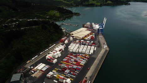 industrial cargo port in dunedin city, new zealand, aerial drone view