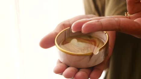 a woman holding an ashtray