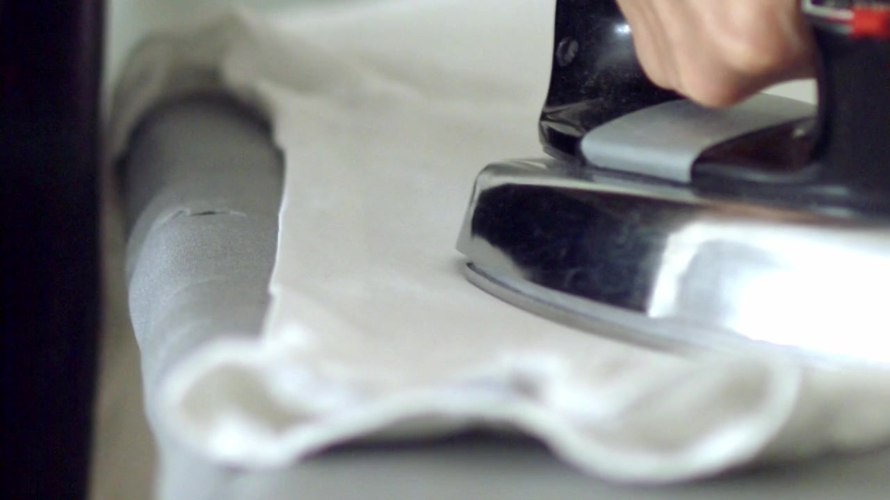 Slow motion, modern home domestic appliance, fresh clean white garment