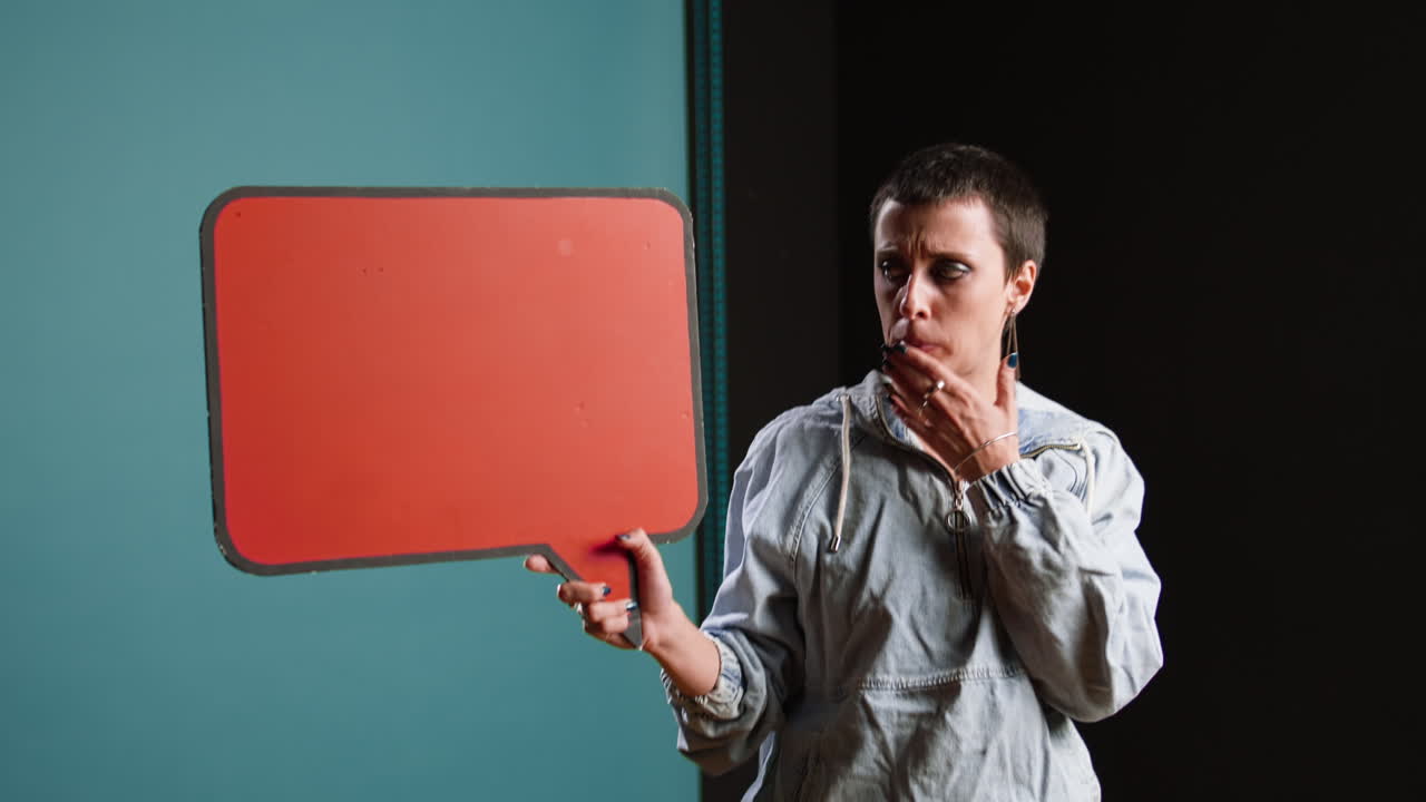 Woman holding a red speech bubble
