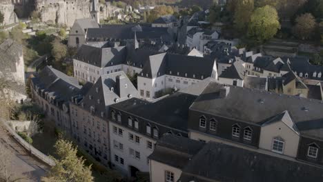 slow tilt up old town of luxembourg on a sunny day with blue sky