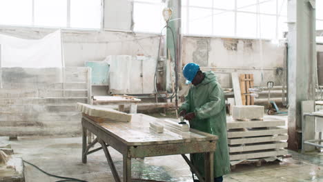 man polishing marble