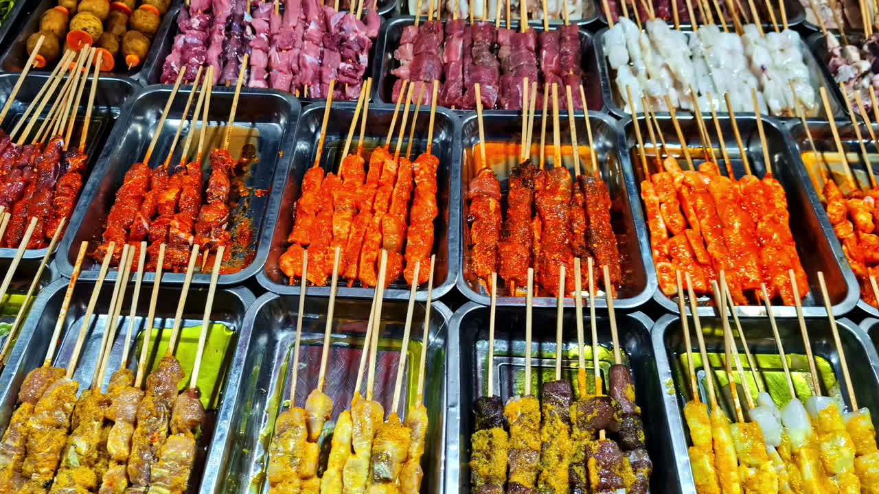 Colorful skewers arranged in trays at Gili Trawangan street food market